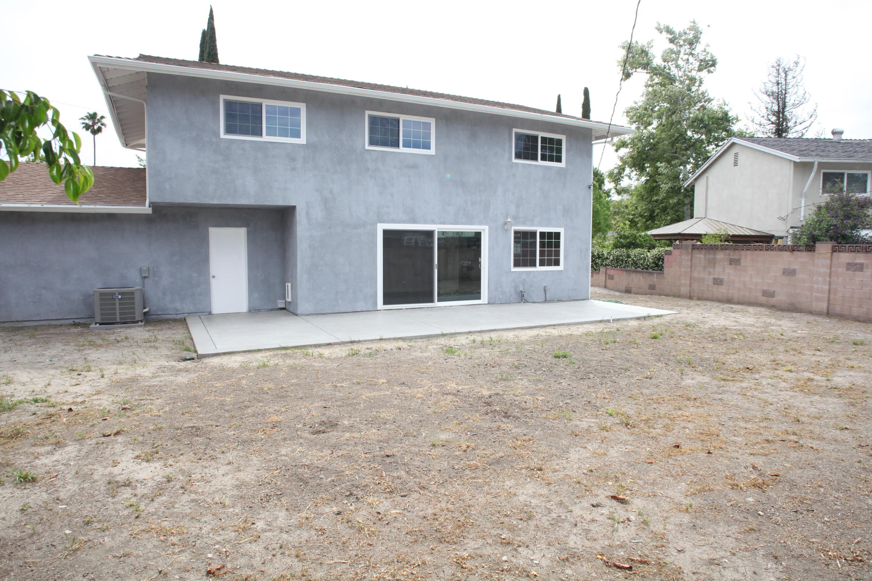 2061 Rhoda Street Simi Valley, CA 93065 - Photo 23 of 27 a view of a house with a yard