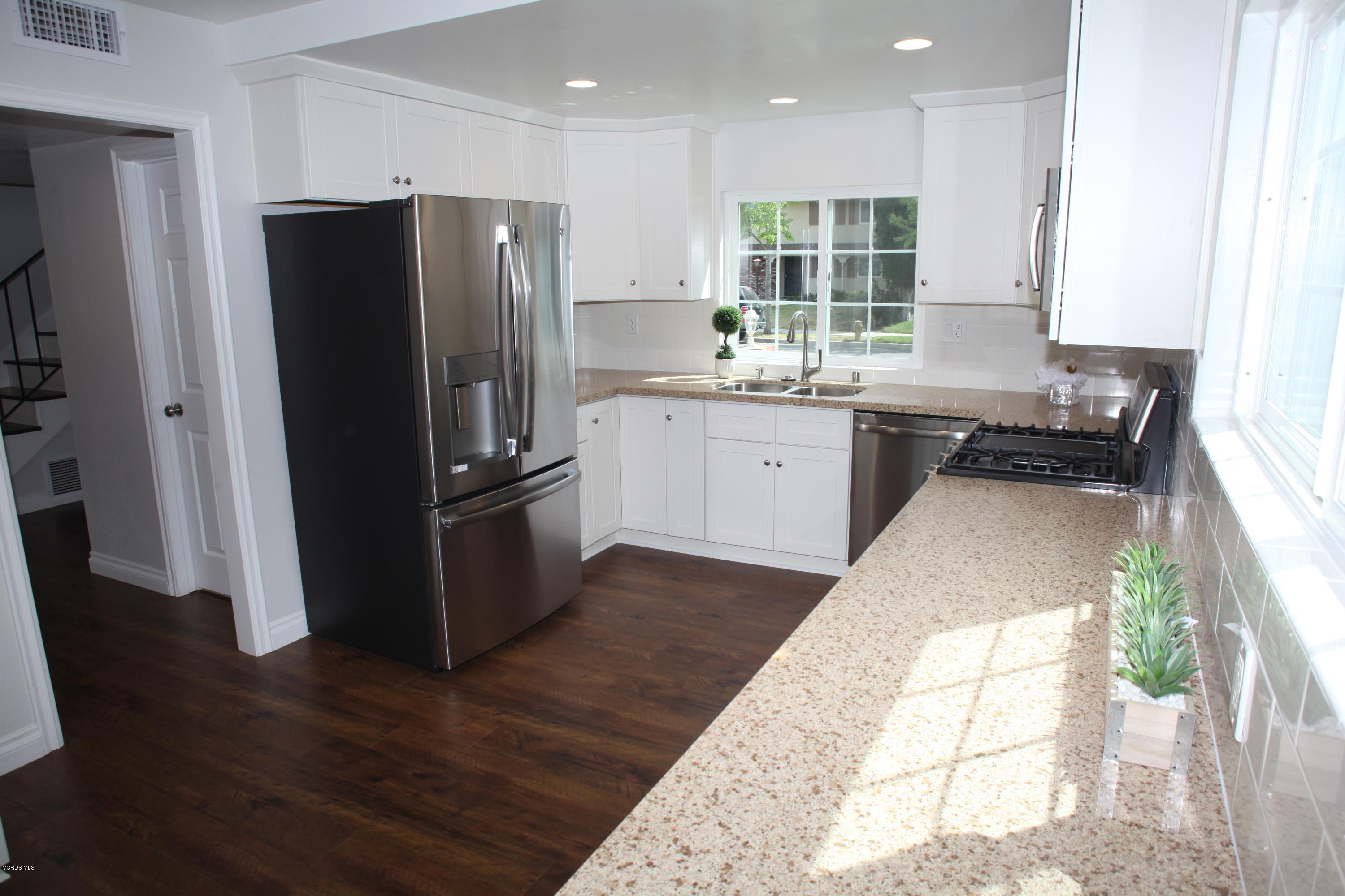 2061 Rhoda Street Simi Valley, CA 93065 - Photo 10 of 27 a kitchen with a refrigerator and a sink
