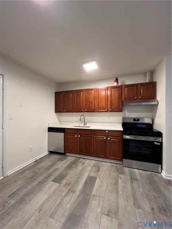 1403 Algona Road Chesapeake, VA 23324 - Photo 12 of 39 Kitchen featuring wood-finish flooring, white coun