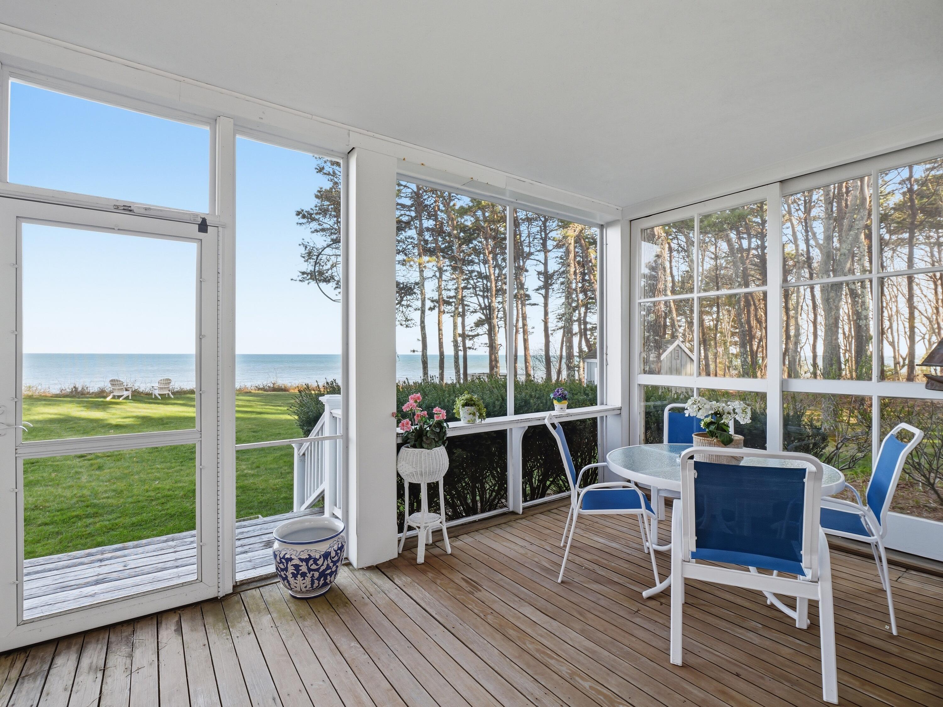 190 Vineyard Road Cotuit, MA 02635 - Photo 20 of 41 a living room with furniture and large windows