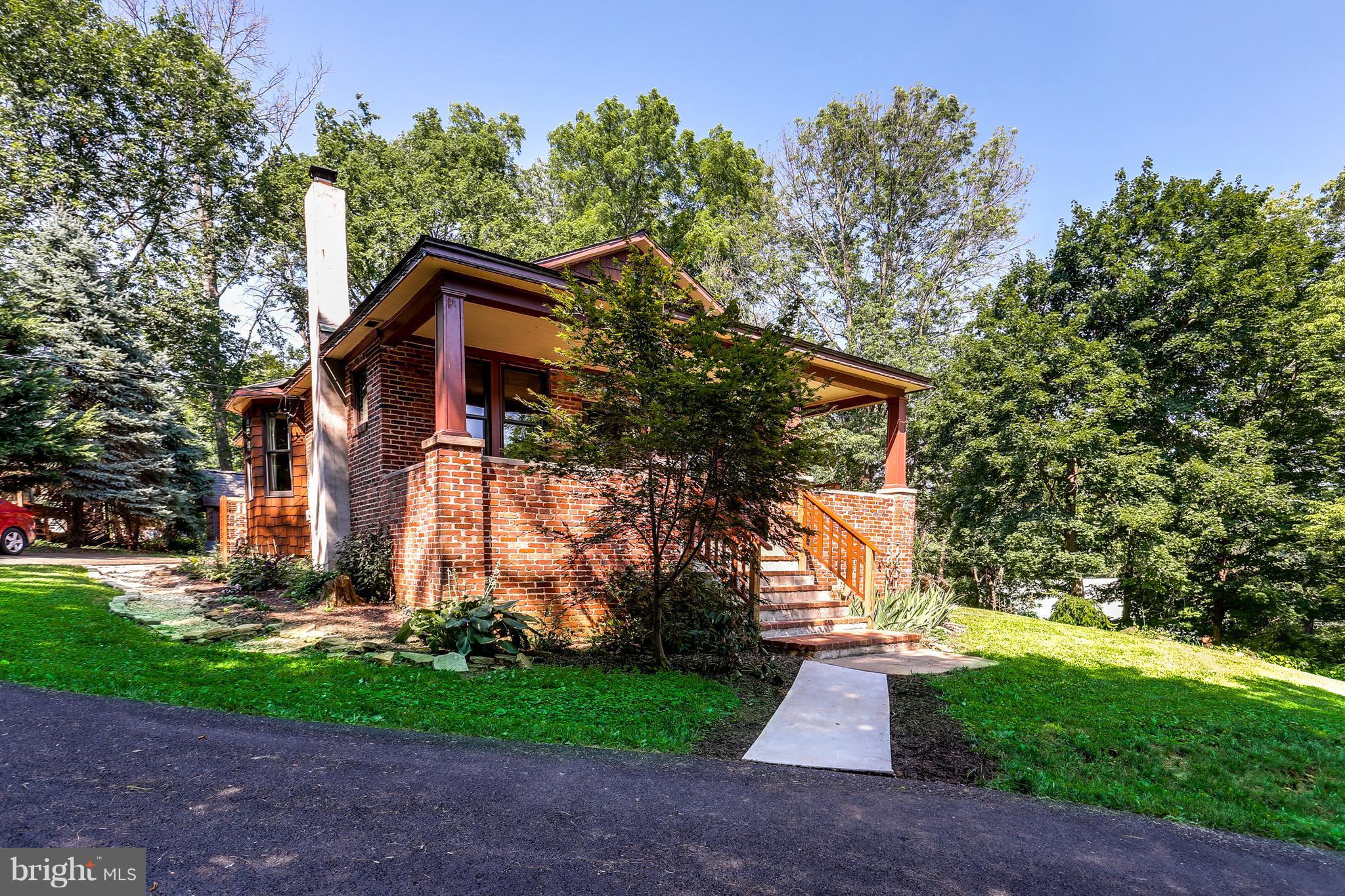 100 Hillside Road Baltimore, MD 21228 - Photo 1 of 30 a front view of a house with a yard and tree s