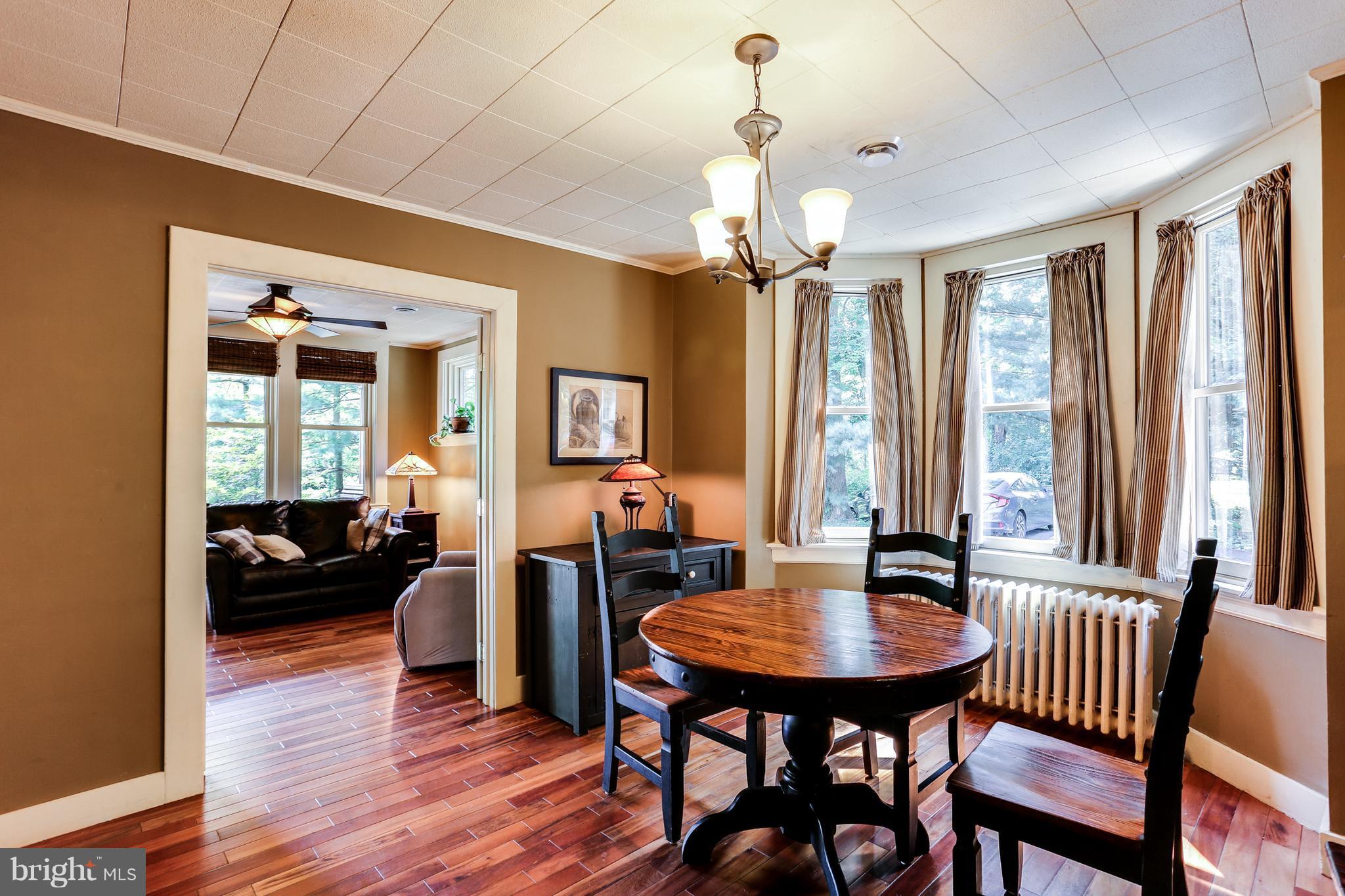 100 Hillside Road Baltimore, MD 21228 - Photo 11 of 30 a view of a dining room with furniture window and wooden floor