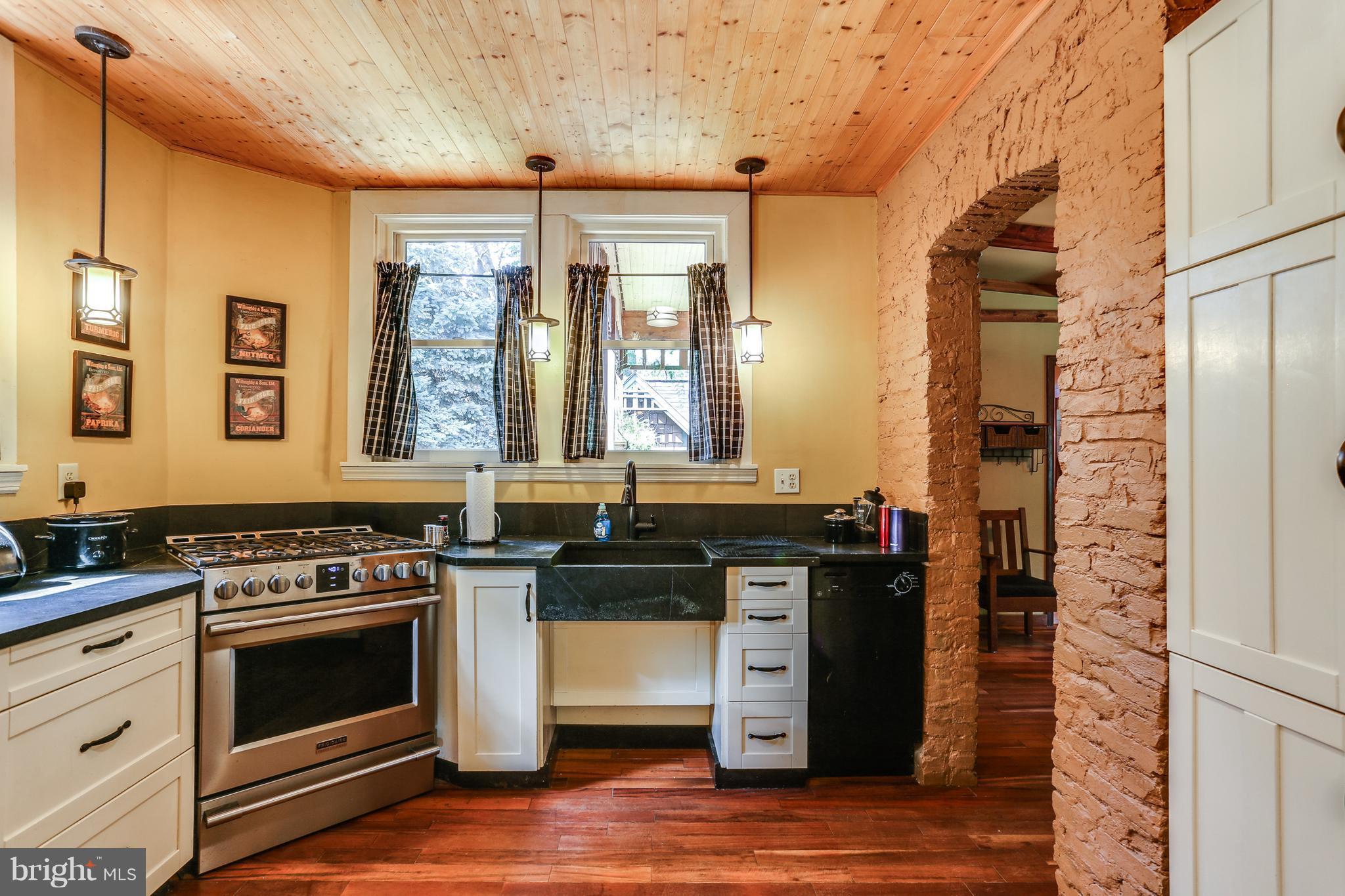 100 Hillside Road Baltimore, MD 21228 - Photo 14 of 30 a kitchen with a stove and a wooden floors
