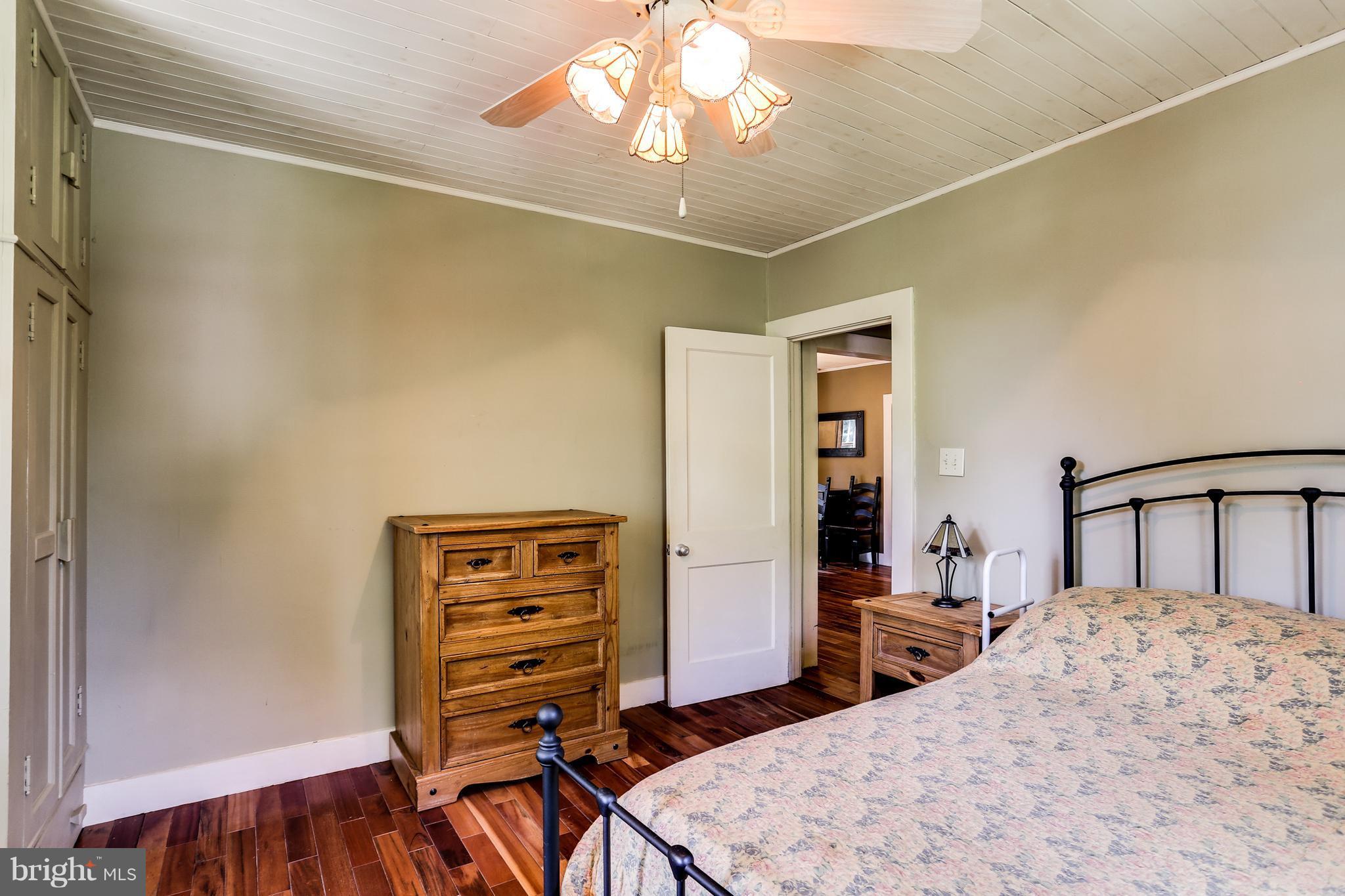100 Hillside Road Baltimore, MD 21228 - Photo 21 of 30 a bedroom with a bed and a dresser
