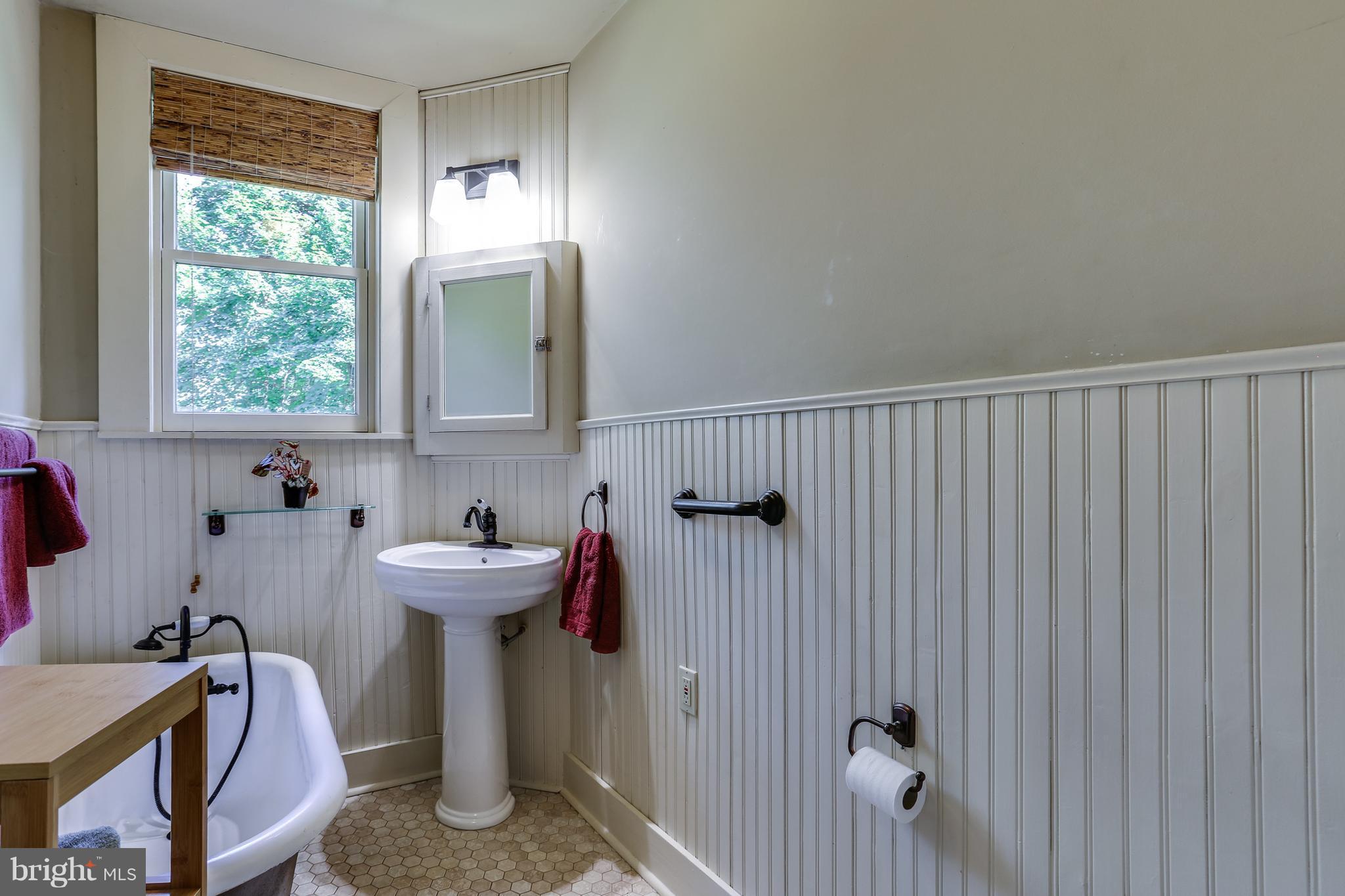 100 Hillside Road Baltimore, MD 21228 - Photo 22 of 30 a bathroom with a sink and a toilet