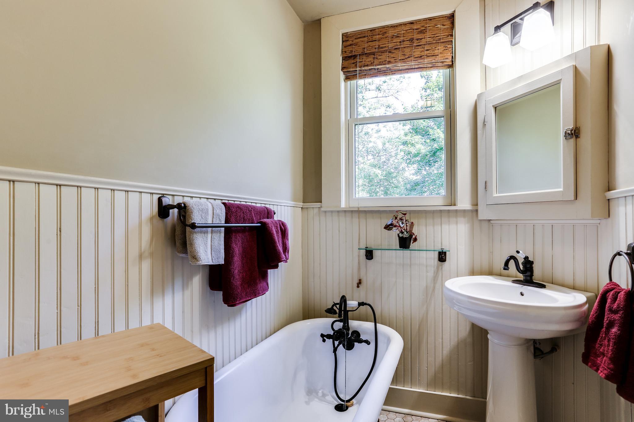 100 Hillside Road Baltimore, MD 21228 - Photo 23 of 30 a bathroom with a sink and a mirror