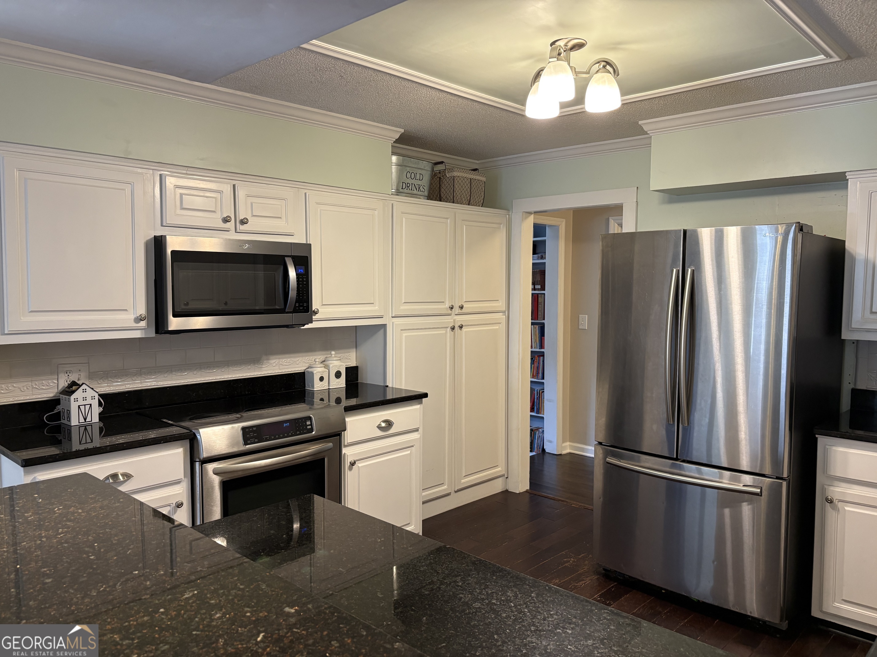 502 Payne Place Dublin, GA 31021 - Photo 17 of 61 a kitchen with a refrigerator stove and microwave