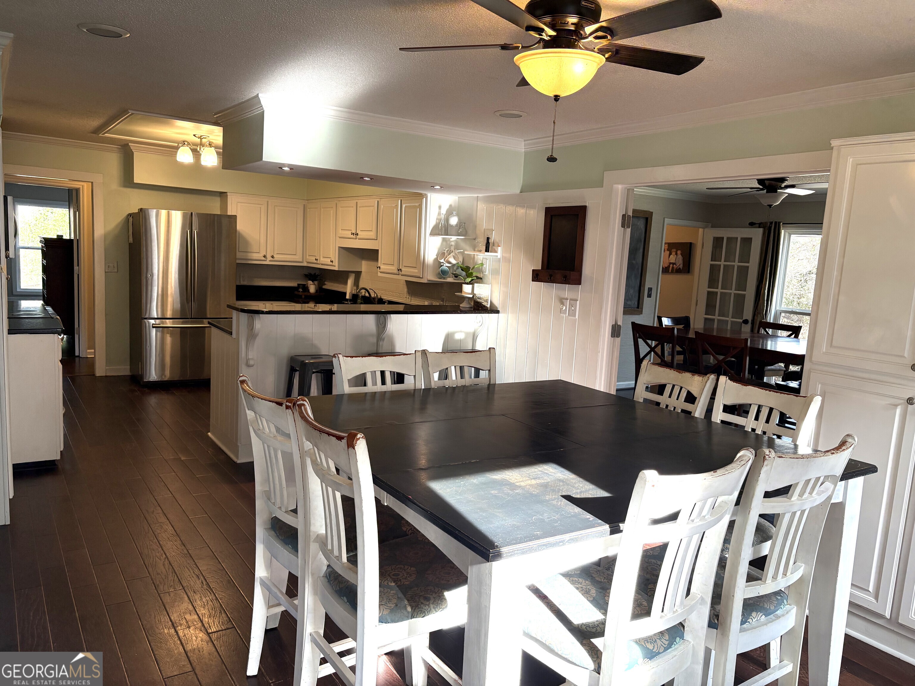 502 Payne Place Dublin, GA 31021 - Photo 18 of 61 a kitchen with a dining table chairs and refrigerator