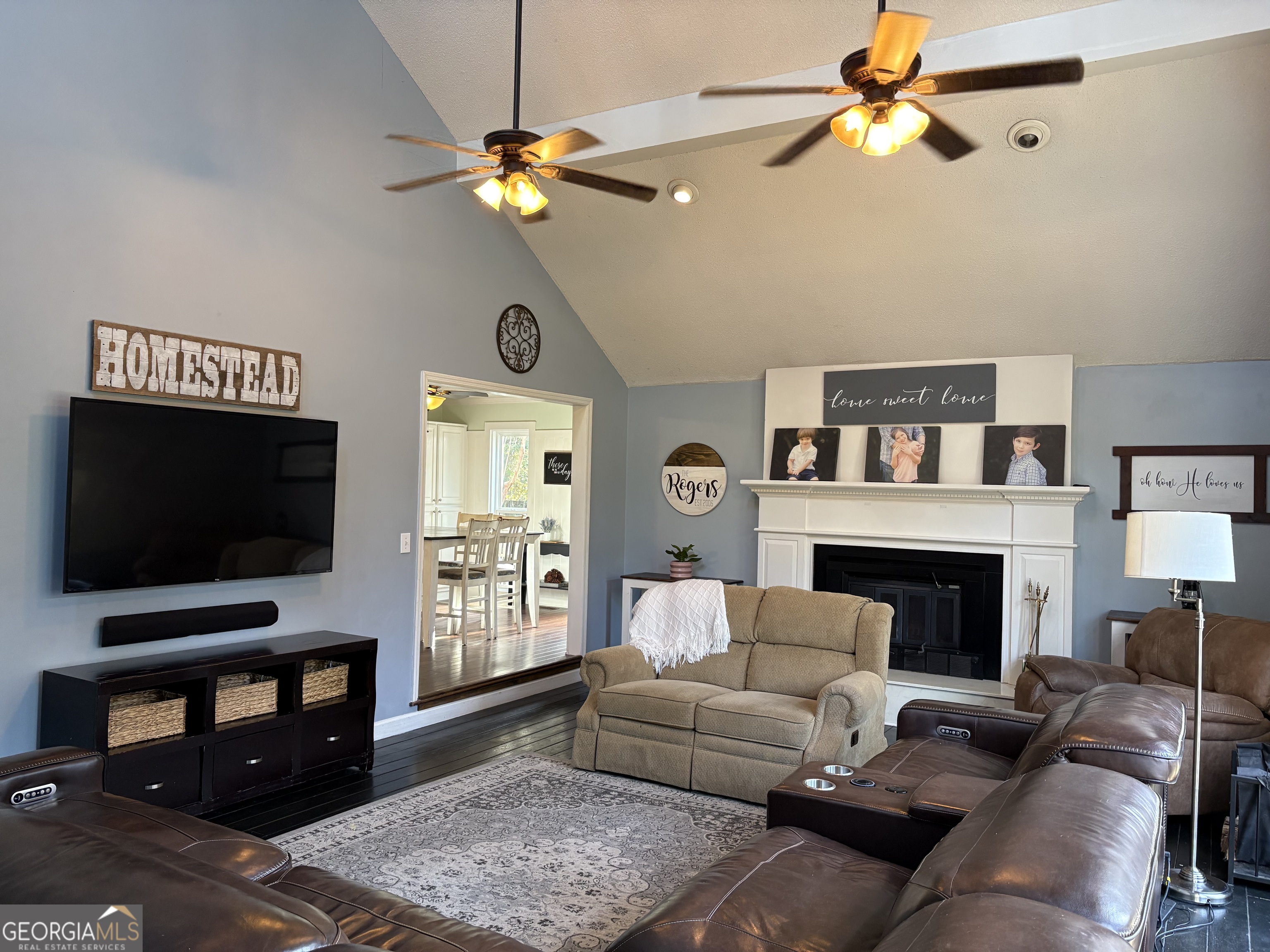 502 Payne Place Dublin, GA 31021 - Photo 23 of 61 a living room with furniture a fireplace and a flat screen tv