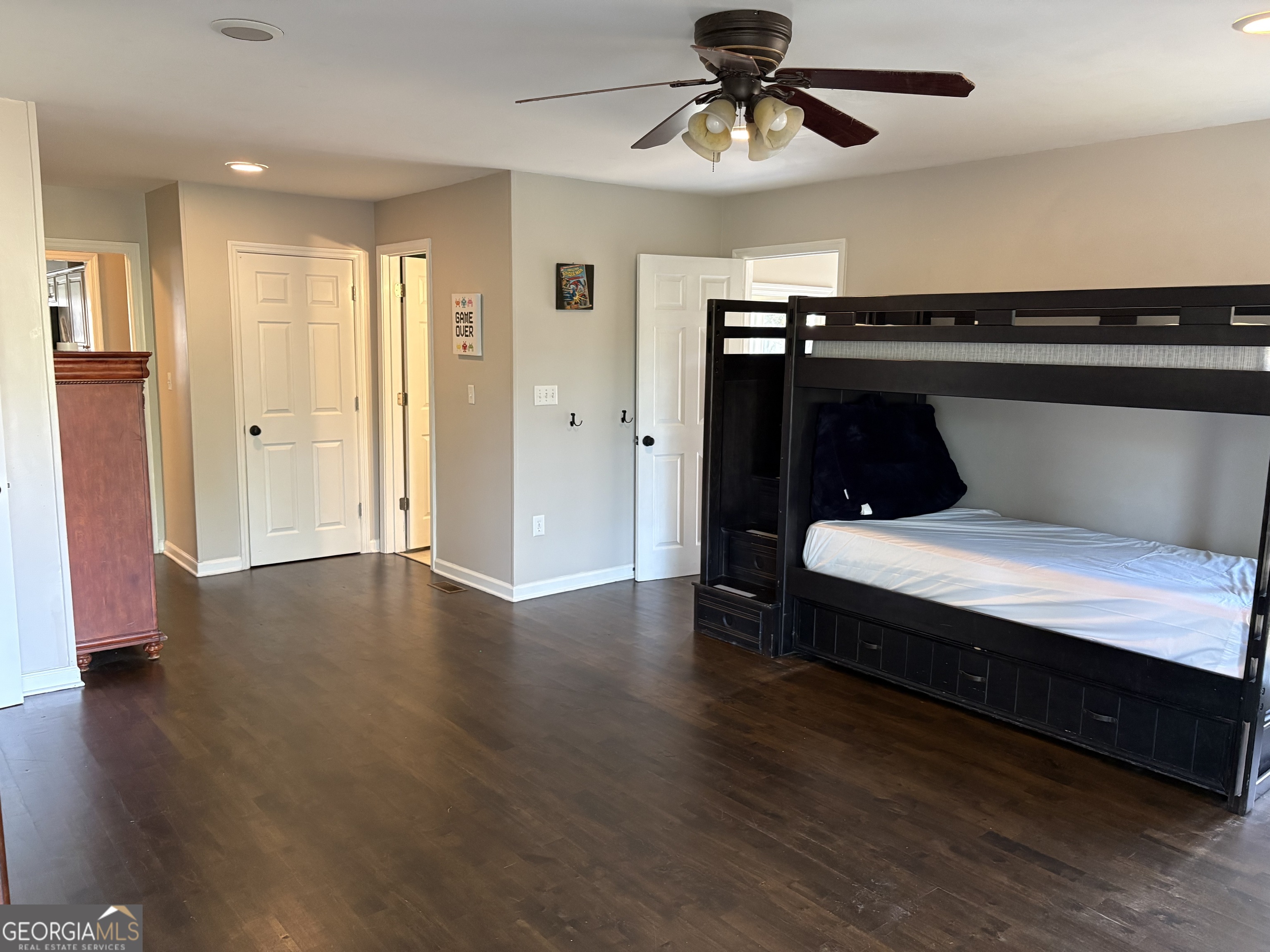 502 Payne Place Dublin, GA 31021 - Photo 37 of 61 a bedroom with a bed and wooden floor