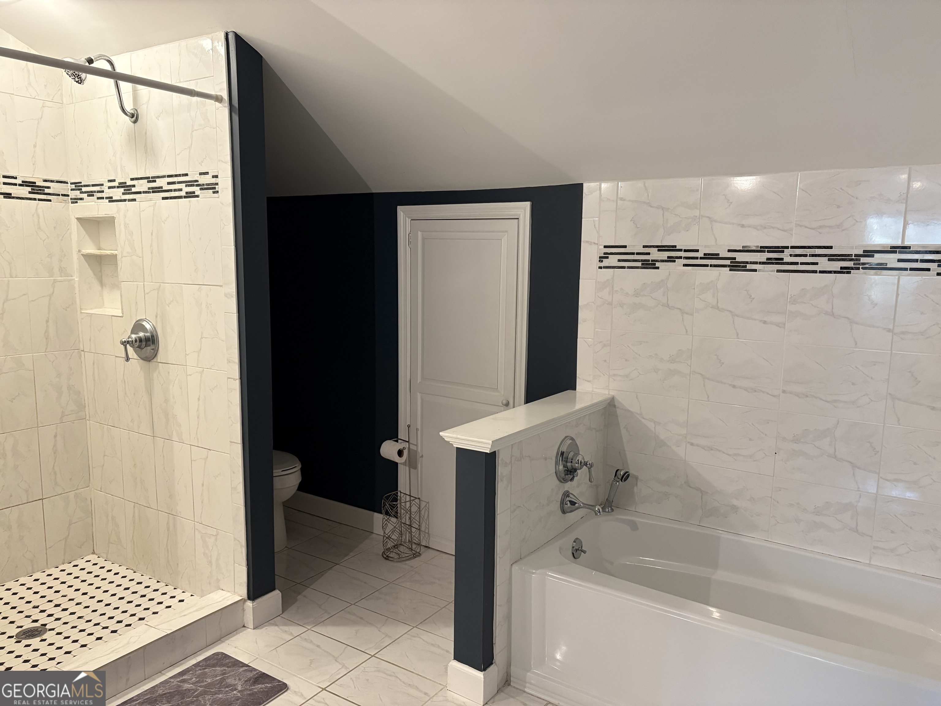 502 Payne Place Dublin, GA 31021 - Photo 47 of 61 a bathroom with a bathtub and a shower