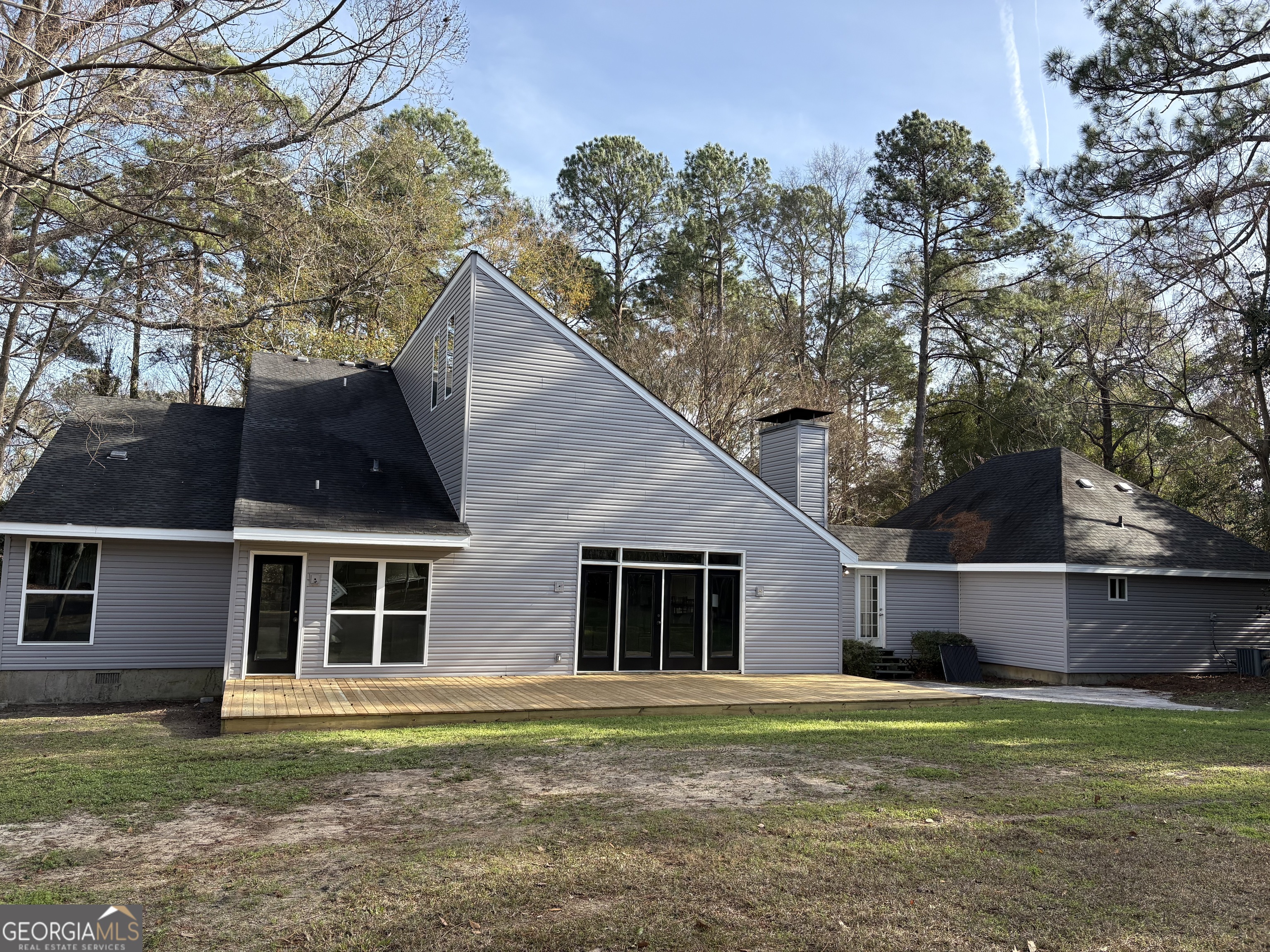 502 Payne Place Dublin, GA 31021 - Photo 56 of 61 a front view of house with yard and trees in the background