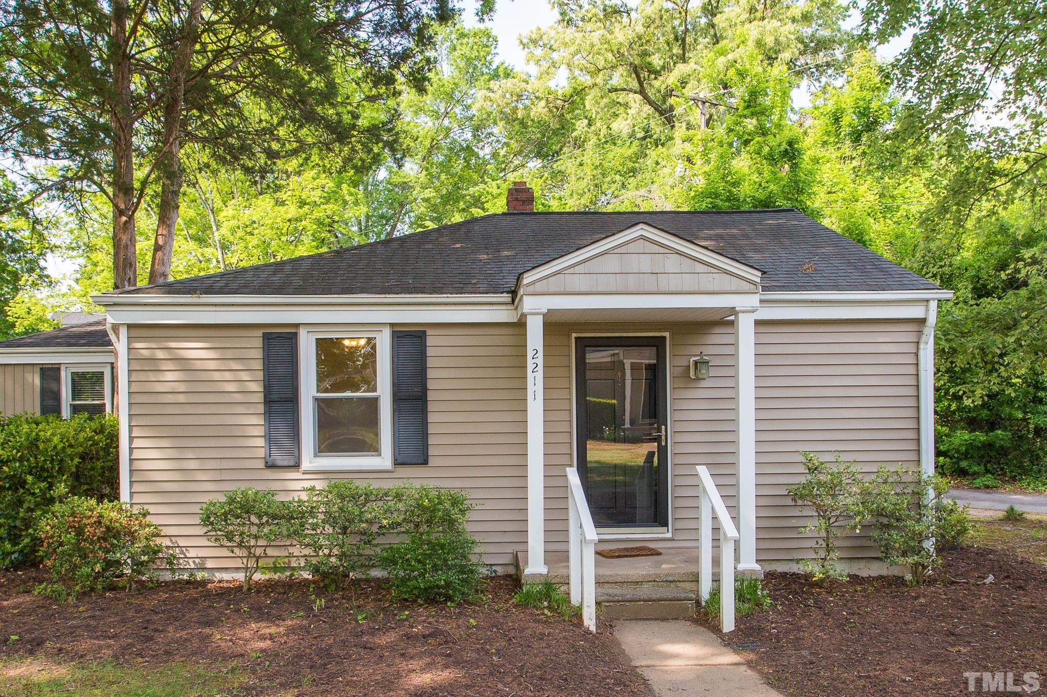 2211 Bernard Street, Unit 2211 Raleigh, NC 27608 - Photo 1 of 15 a front view of a house with a garden