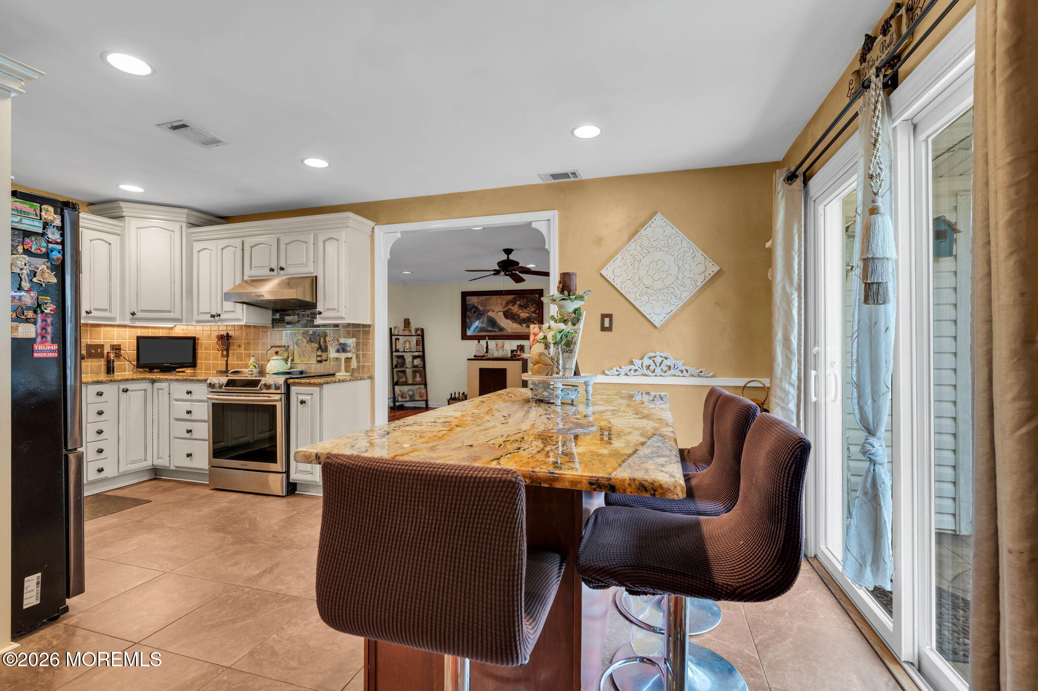8 Owens Road Marlboro, NJ 07746 - Photo 14 of 39 a open kitchen with stainless steel appliances granite countertop a stove refrigerator and a view of living room