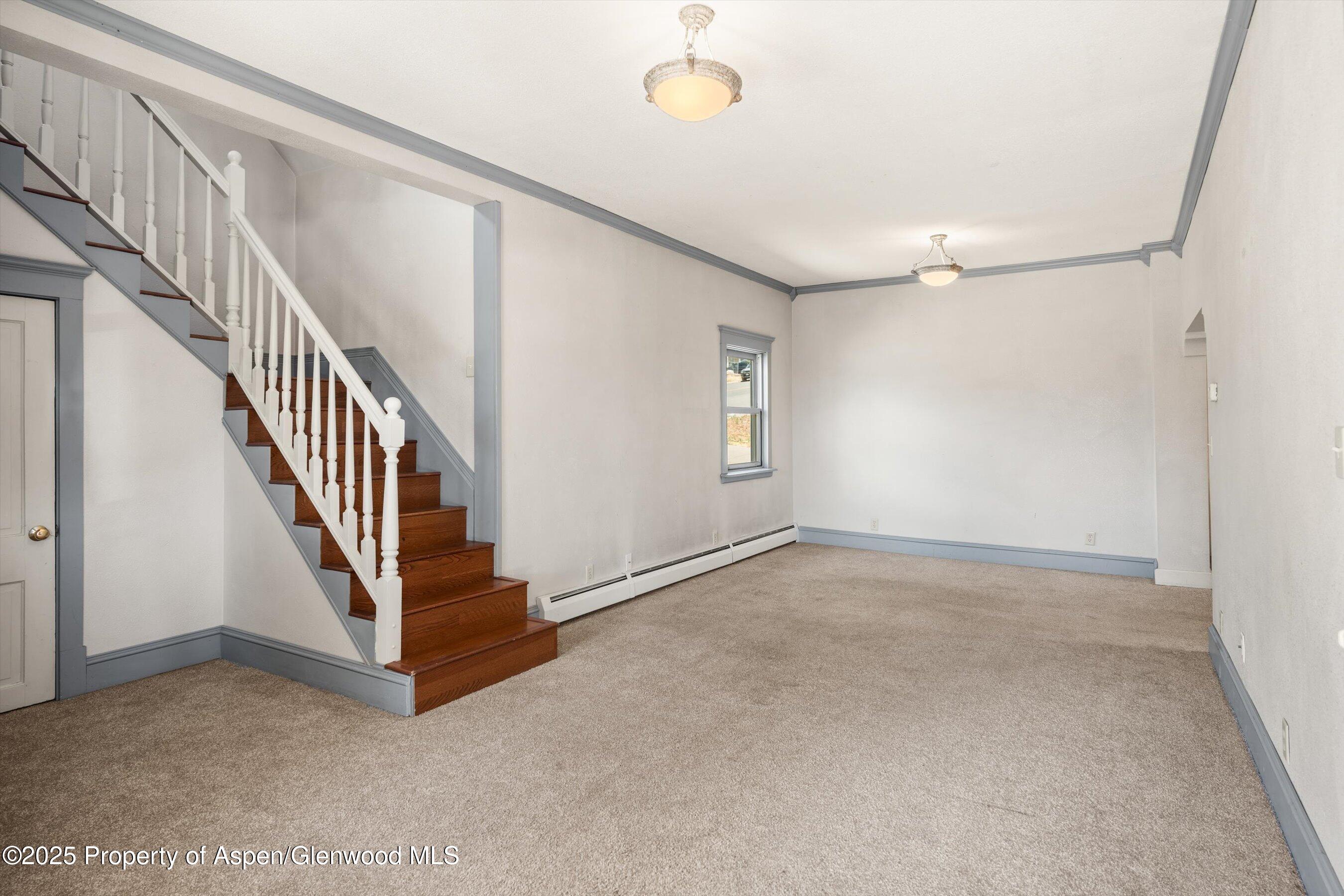 440 Whiteriver Avenue Rifle, CO 81650 - Photo 12 of 25 a view of an empty room with stairs
