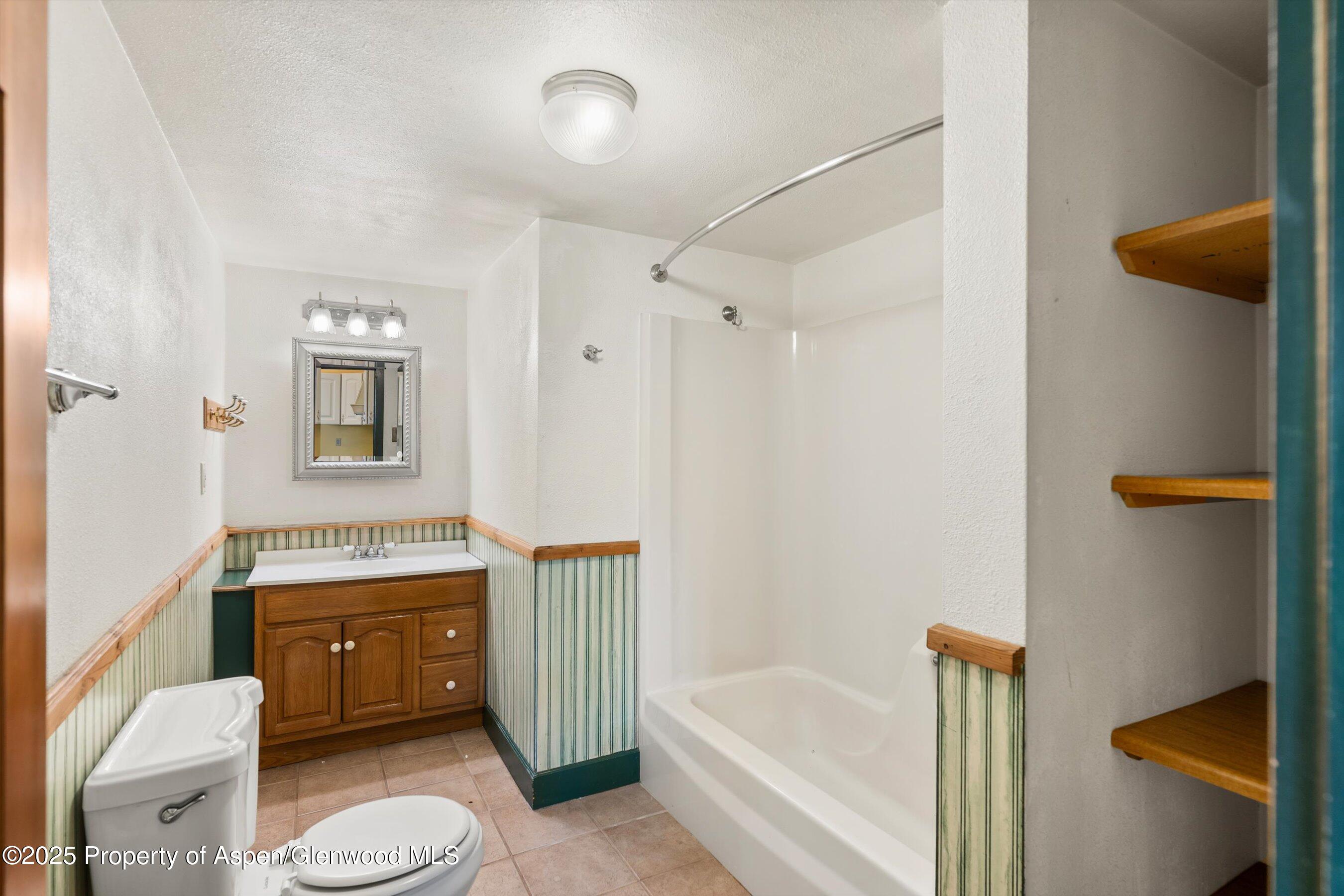 440 Whiteriver Avenue Rifle, CO 81650 - Photo 19 of 25 a bathroom with a sink toilet and shower