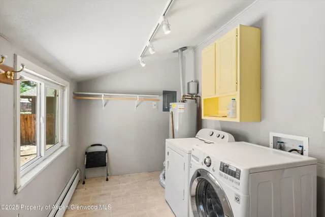 a utility room with dryer and washer