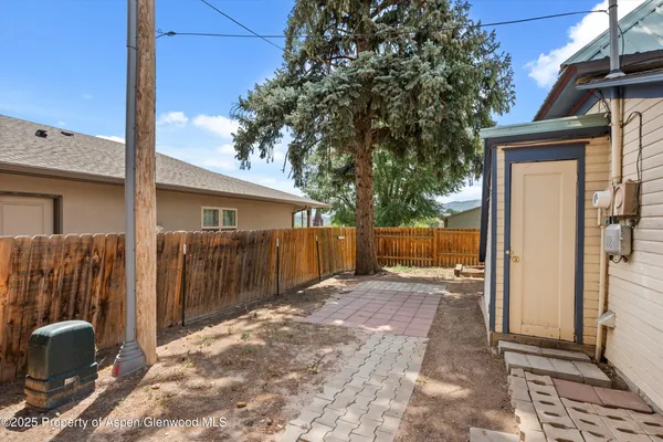 a view of backyard with cabin