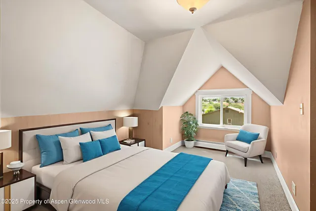 a bedroom with a bed and a couch