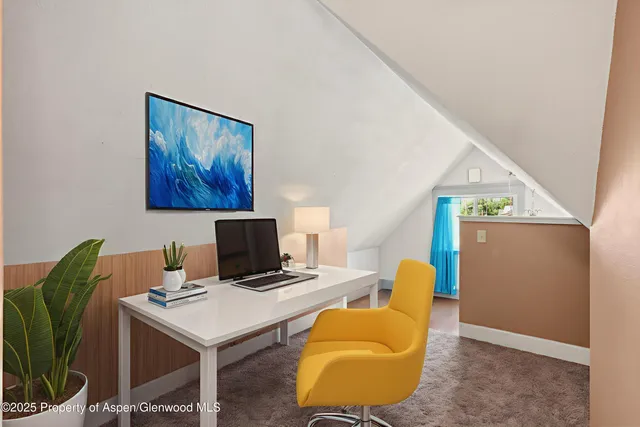 a workspace with furniture and a lamp