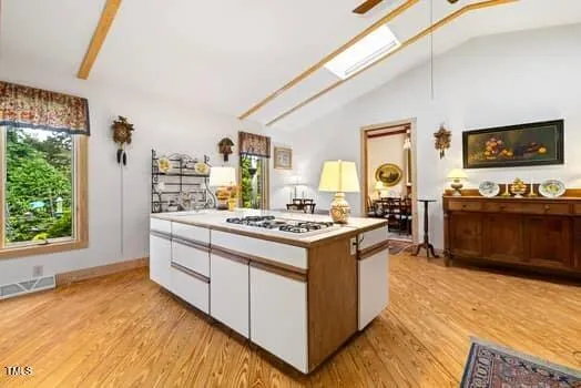 a kitchen with stainless steel appliances granite countertop a stove and a refrigerator