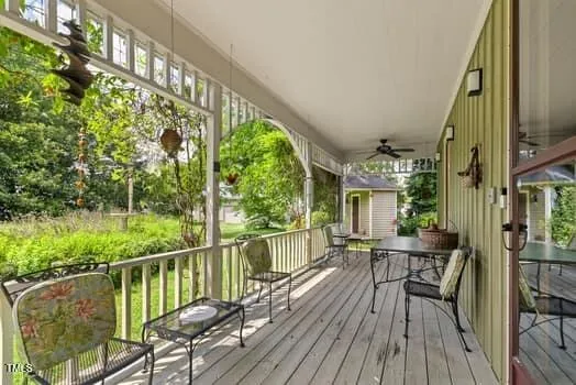 a living room with furniture a chandelier and a fireplace