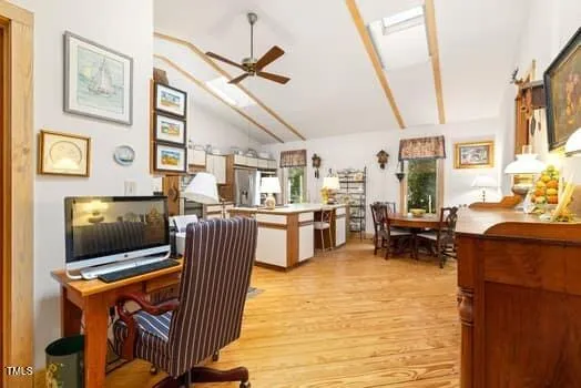 a living room with furniture fireplace and a chandelier
