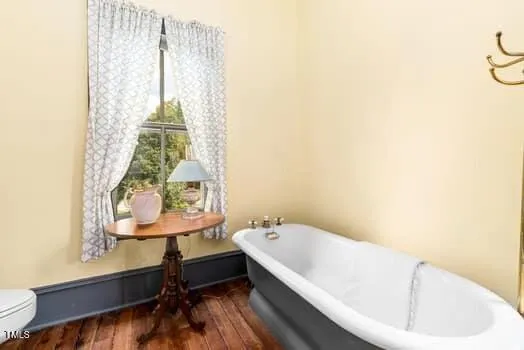 a view of a balcony with floor to ceiling windows with wooden floor