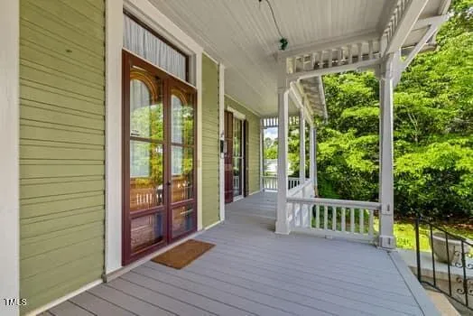 a view of a balcony with wooden floor