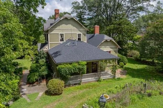 an aerial view of a house with outdoor space and street view