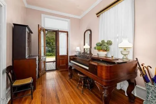 a dining room with furniture and wooden floor
