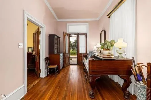 a living room with furniture a fireplace and a chandelier
