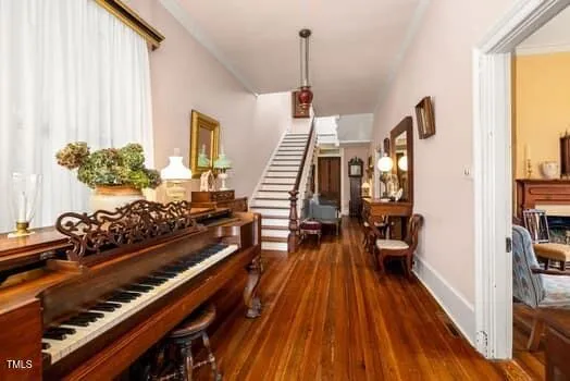 a view of a dining room with furniture and a chandelier