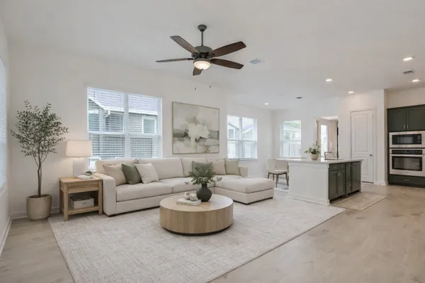 a living room with furniture and a large window