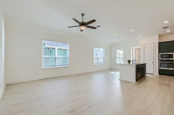 a view of a kitchen with furniture and windows