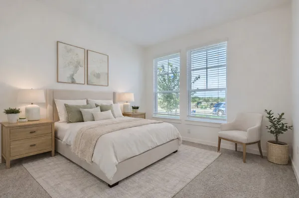 a bedroom with a bed and a couch