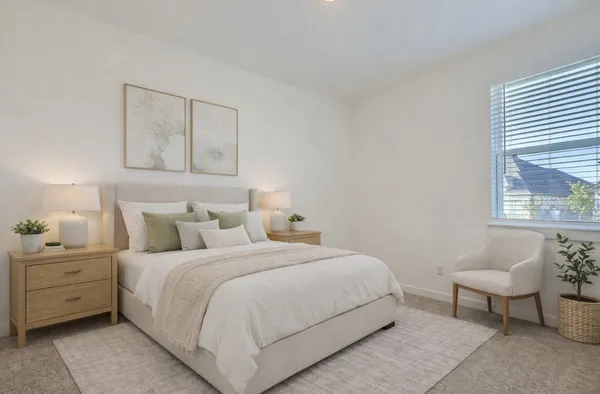 a bedroom with a bed and a lamp with window