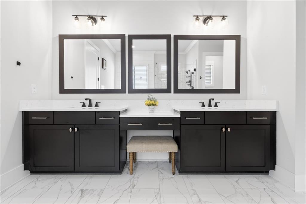 3528 North Bogan Road Buford, GA 30519 - Photo 26 of 79 a bathroom with a sink vanity and mirror