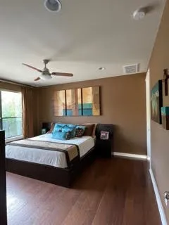 a bedroom with a bed and a window