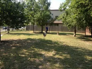 a swimming pool with outdoor seating and yard