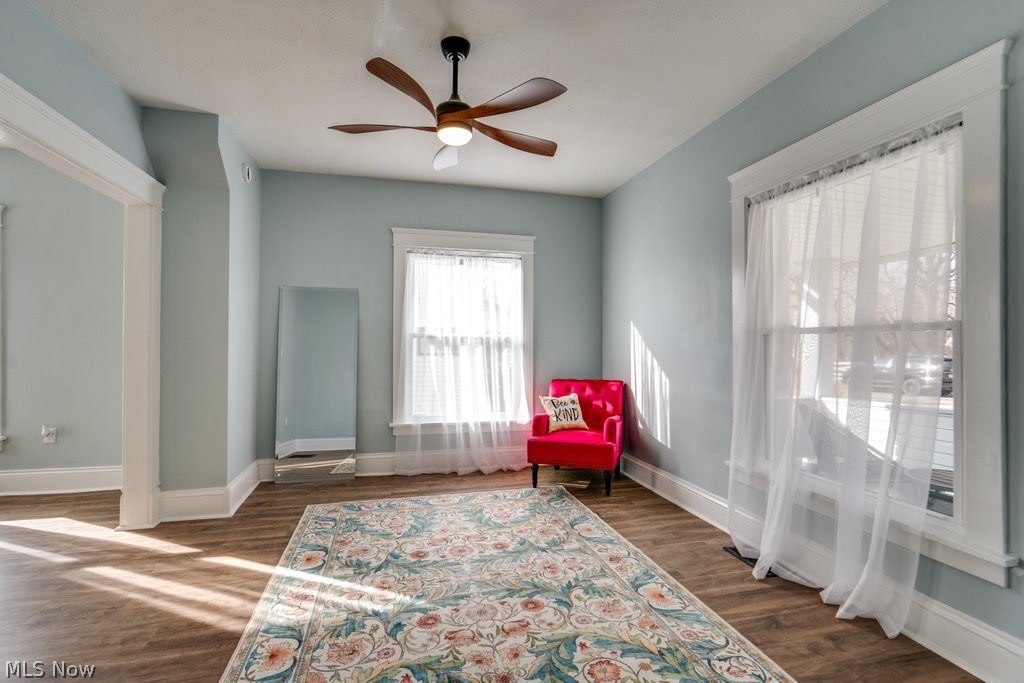 12 South 4th Street Rittman, OH 44270 - Photo 10 of 48 Living area featuring a ceiling fan and dark wood-style flooring