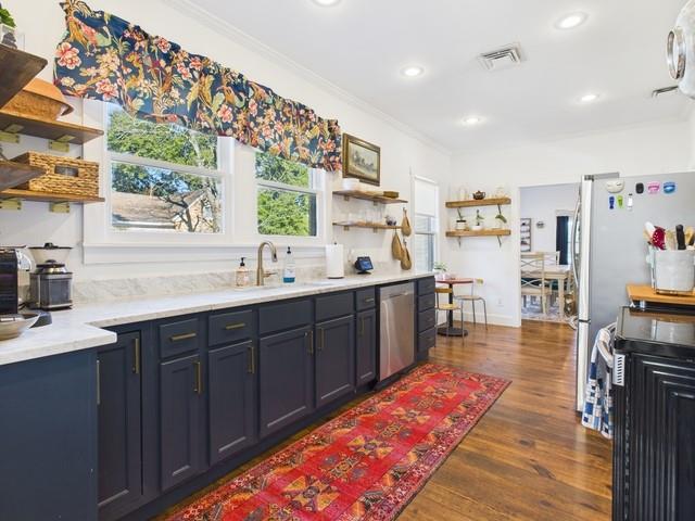 226 South Pinkerton Street Athens, TX 75751 - Photo 11 of 35 a kitchen with stainless steel appliances granite countertop a sink and cabinets