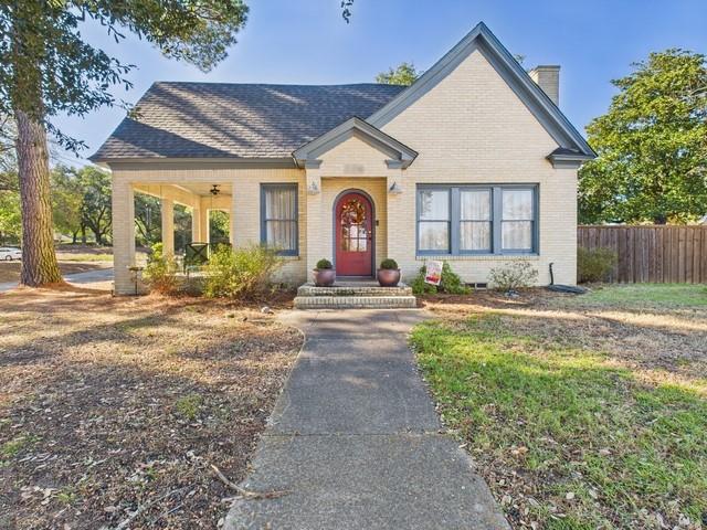 226 South Pinkerton Street Athens, TX 75751 - Photo 2 of 35 a front view of a house with a yard and a garage