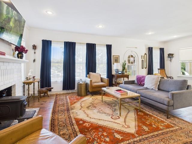 226 South Pinkerton Street Athens, TX 75751 - Photo 4 of 35 a living room with furniture flat screen tv and a fireplace