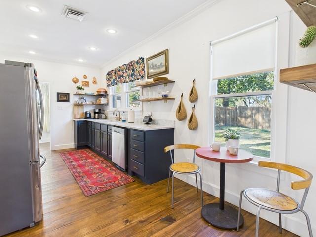 226 South Pinkerton Street Athens, TX 75751 - Photo 9 of 35 a very nice looking open kitchen with stainless steel appliances granite countertop a refrigerator and a stove top oven