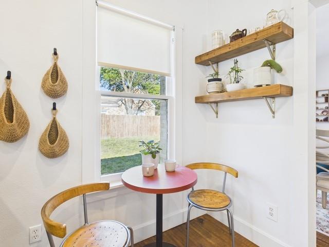 226 South Pinkerton Street Athens, TX 75751 - Photo 10 of 35 a view of a dining room with furniture a potted plant and wooden floor