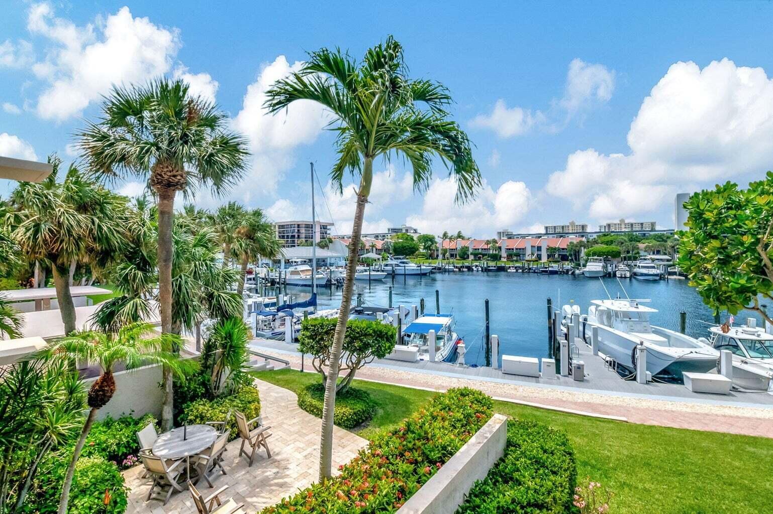 2707 North Ocean Boulevard, Unit D205 Boca Raton, FL 33431 - Photo 14 of 51 a view of a lake with a garden and swimming pool