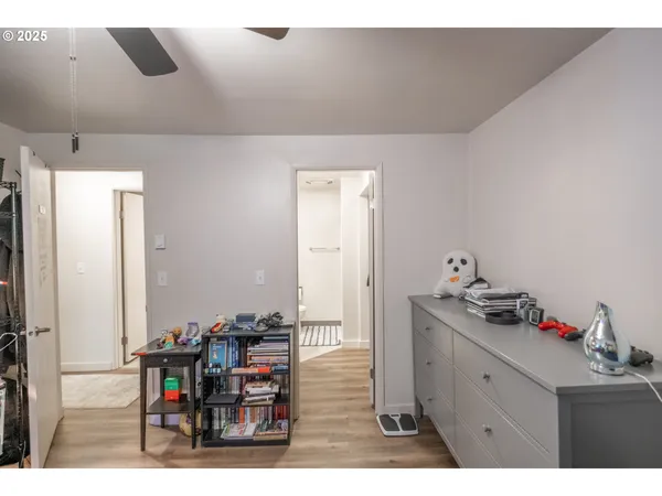 a room with pool table and windows