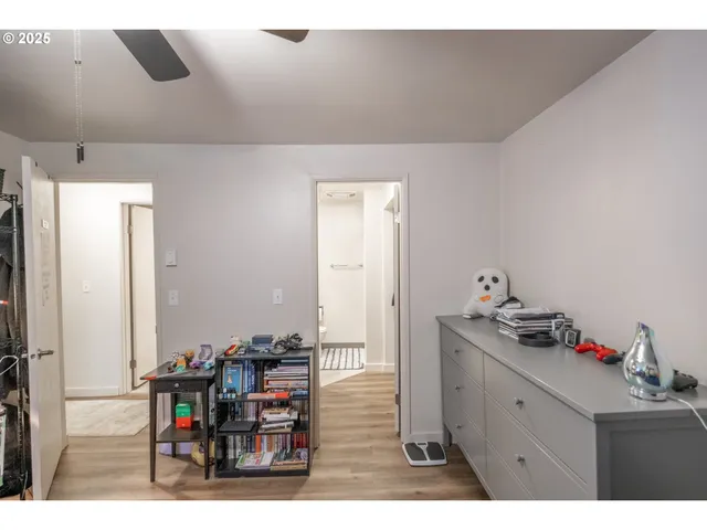 a room with pool table and windows