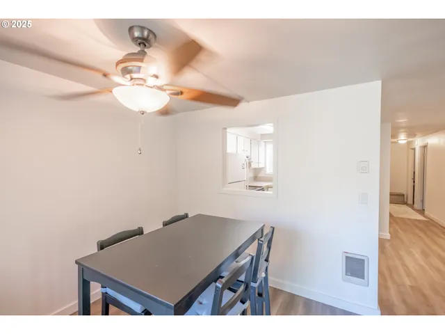 a view of a workspace with furniture and chandelier